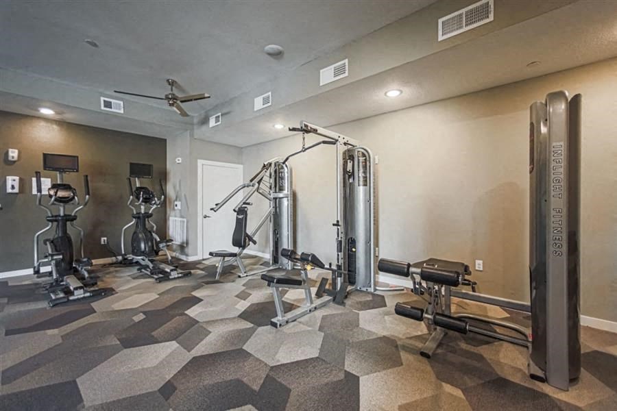 fitness center with strength training equipment at Aspire at 610 apartments