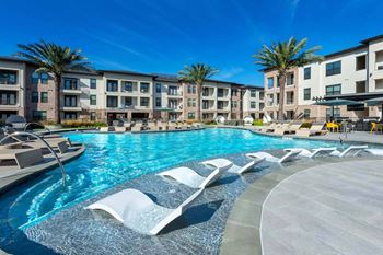 Swimming Pool With Relaxing Sundecks at Berkshire Exchange Apartments, Spring, Texas