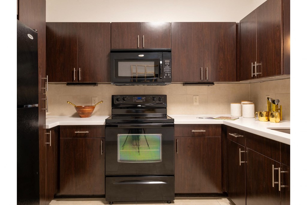 a kitchen with custom cabinetry at The Core apartments