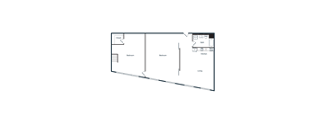 A dark image of a room with a desk and a chair.