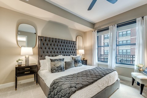 spacious bedroom with a ceiling fan at The Ivy luxury apartments