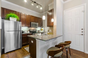 Kitchen appliances and table top at ParkThe Estates 3Eighty, Aubrey, TX - Photo Gallery 36