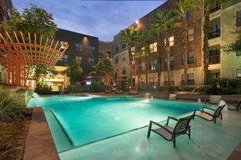 the swimming pool at night at The Core apartments
