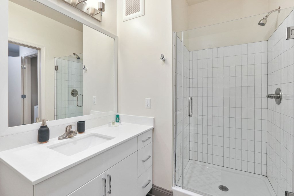 Trellis House apartments bathroom with oversized, tiled shower