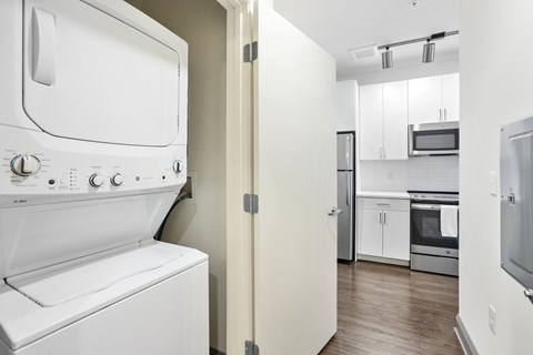 A white oven and microwave in a kitchen.