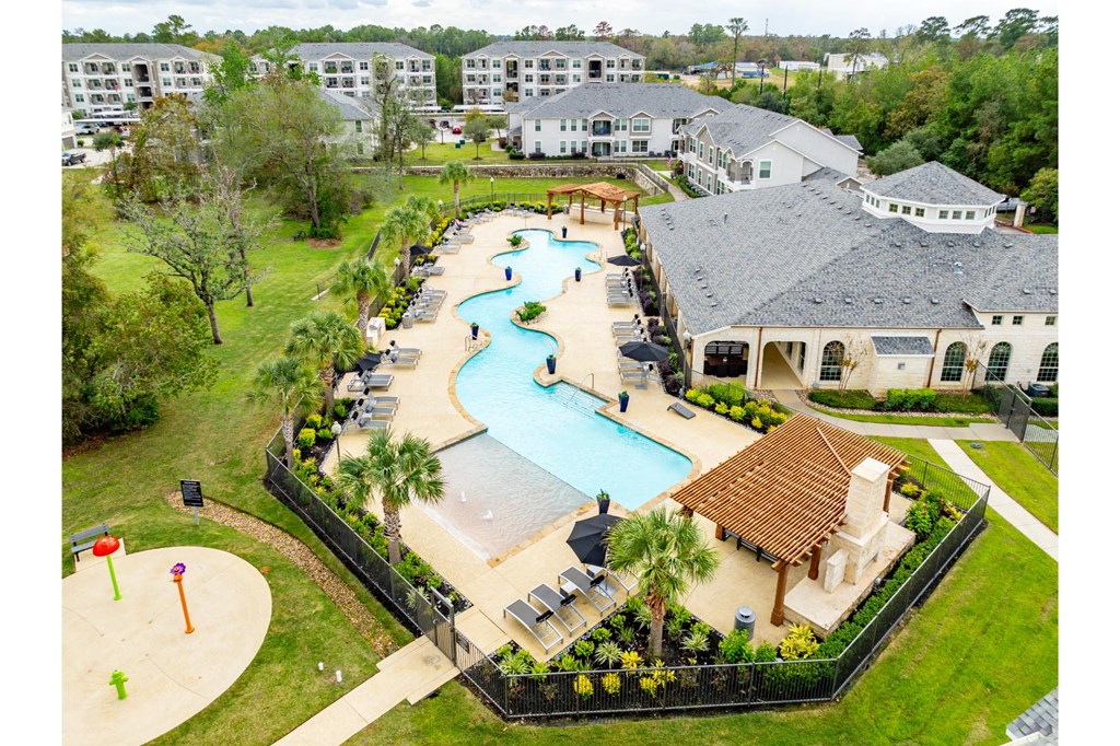 Aerial view of the resort style swimming pool at Villages of Magnolia Apartments