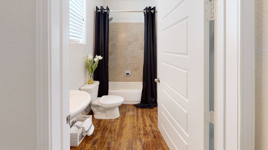 a bathroom with a toilet sink and bathtub