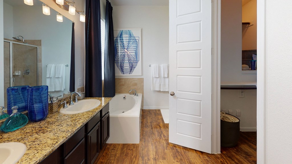 a bathroom with a bathtub and a sink