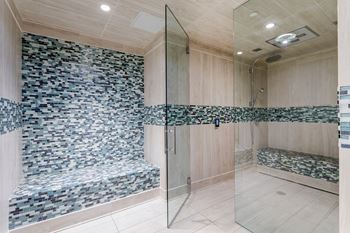 Walk-In Showers With Built-In Bench And Glass Enclosure at Berkshire Lauderdale by the Sea, Florida
