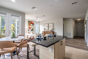 open-concept kitchen and living areas at Reveal Heathrow apartments