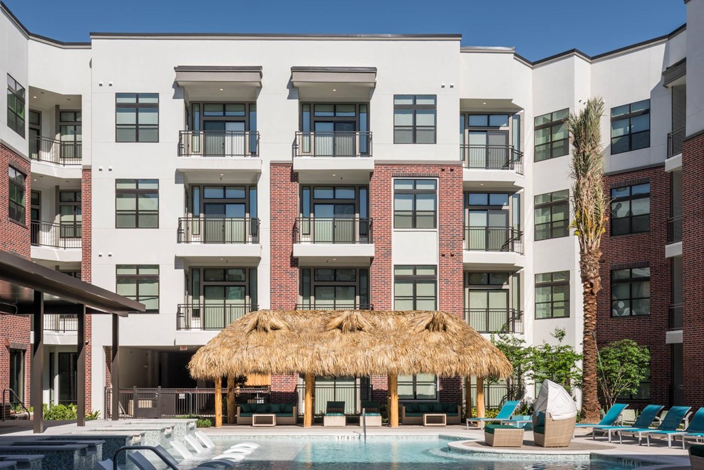exterior view and swimming pool at Tinsley on the Park apartments