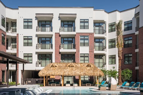 exterior view and swimming pool at Tinsley on the Park apartments