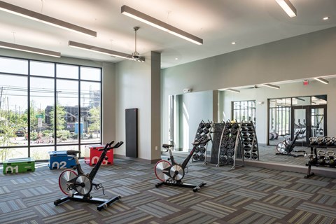 a gym with weights at Tinsley on the Park apartments