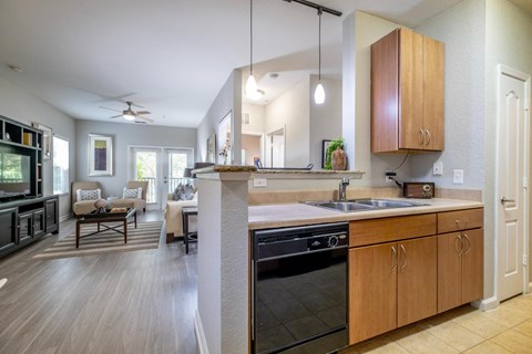 a kitchen and living room at Verano apartments
