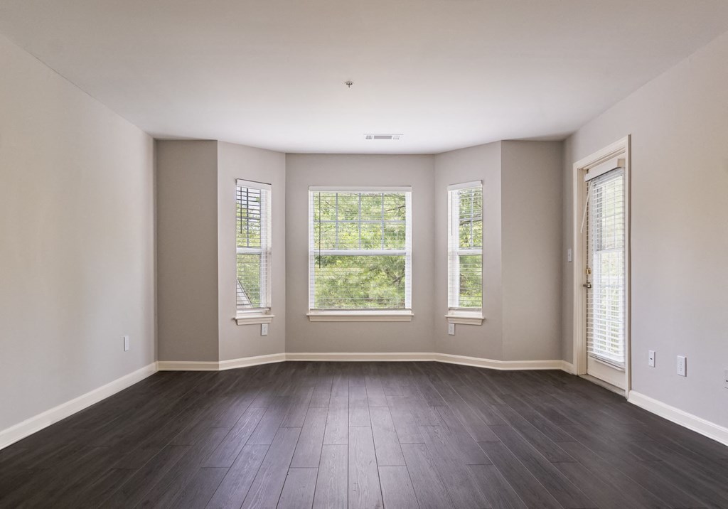 spacious living room with expansive windows at Ellington Metro West apartments