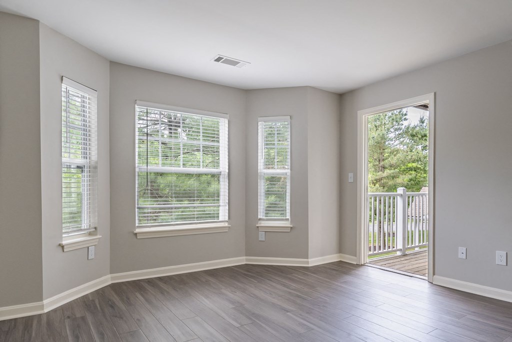 spacious living room open to a balcony at Ellington Metro West apartments