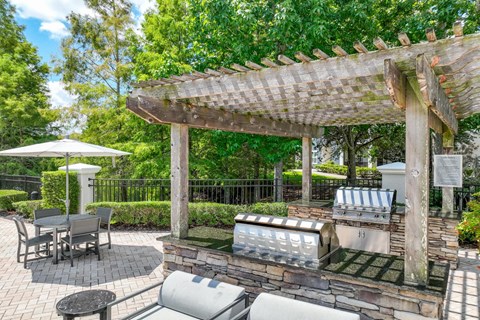 an outdoor grilling station at Verano apartments