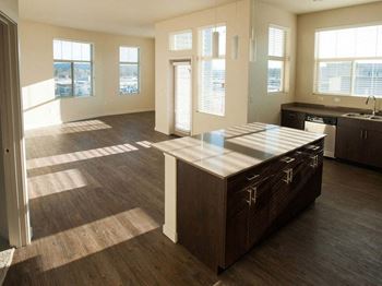 Kitchen and living room at Elan Redmond Apartments, Redmond, Washington
