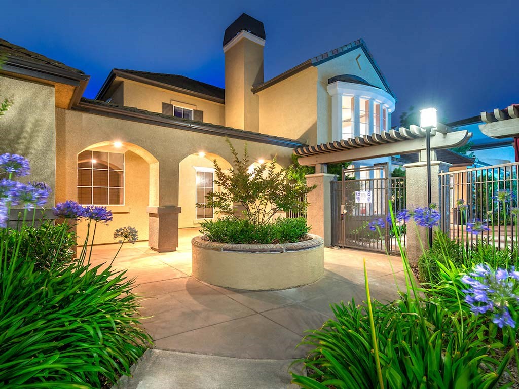 Clubhouse Exterior with Lush Landscape