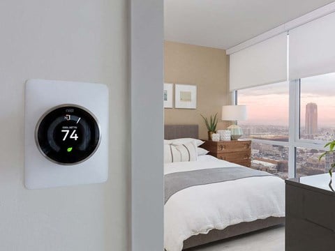 Thermostat with bedroom view at The Rey Apartments in California