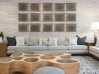 Common area with sofa and coffee table at The Rey, California, 92101 - Photo Gallery 4