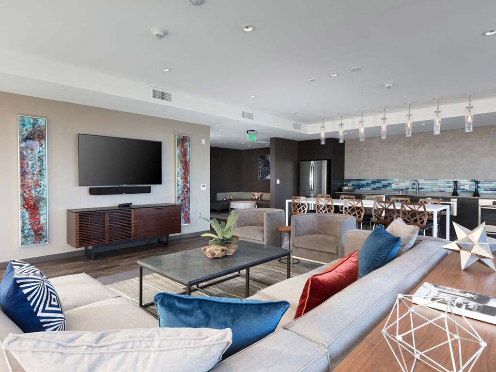 Common area with sofa and kitchen area at Lyric, California, 94596