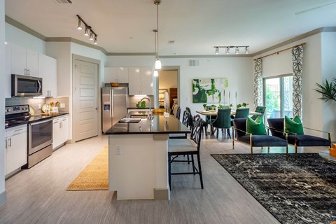 Luxury Vinyl Plank Flooring In Kitchen And Living Room at Berkshire Spring Creek, Garland, TX, 75044