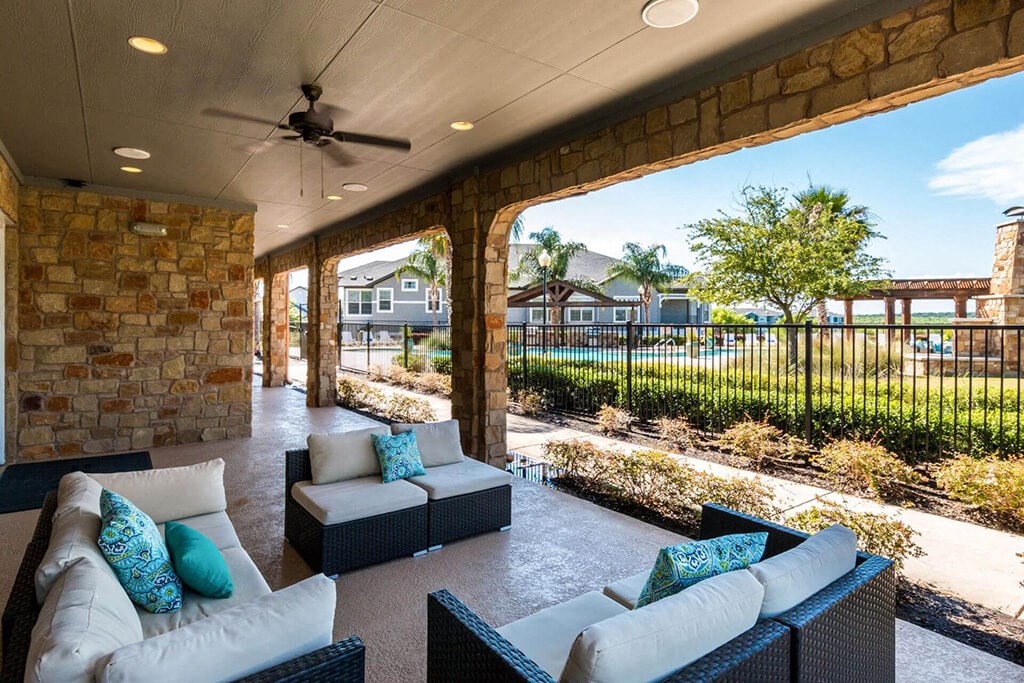 Lounging By The Pool at Villages of Briggs Ranch, San Antonio, 78245