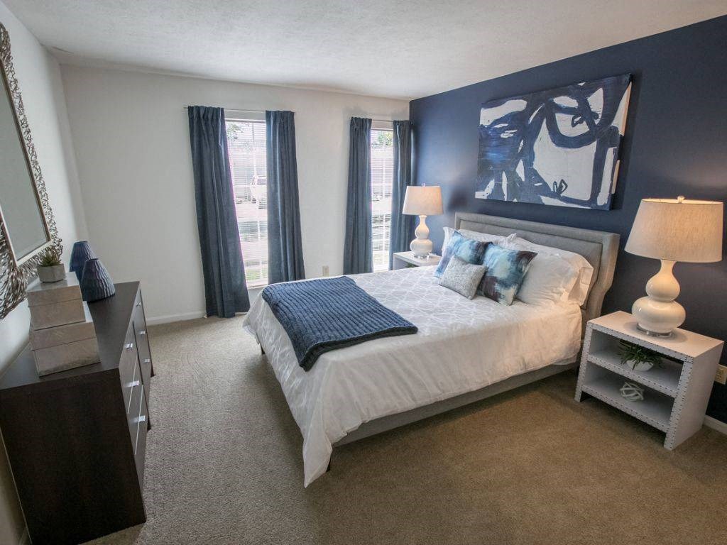 Spacious bedroom with expansive windows Kensington Grove apartments
