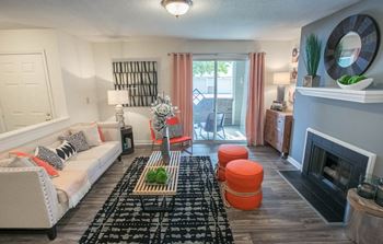 Living room with fireplace at Saw Mill Village apartments