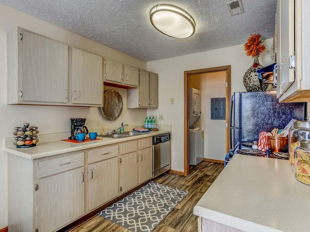 a kitchen with a sink and a refrigerator