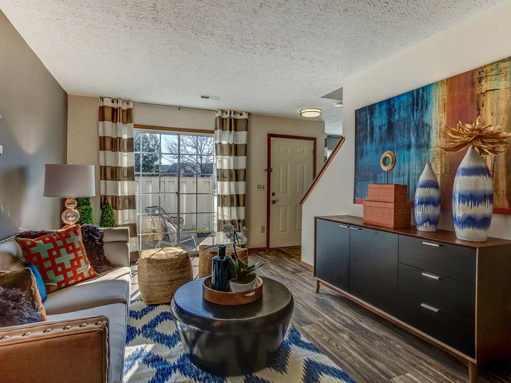 a living room with a couch and a table