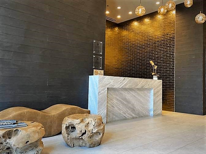a lobby with a reception desk at Tribeca NOMA apartments