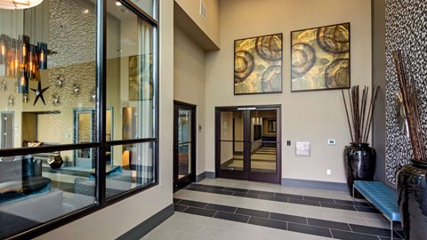 a large lobby with paintings in Reveal Hackensack apartments