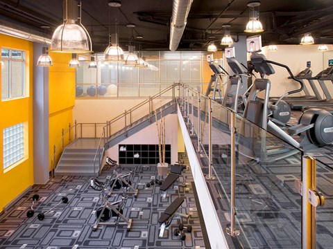 fitness center with cardio machines at Highland Park apartments