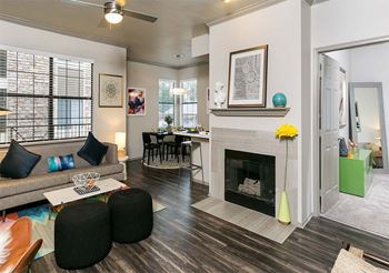 spacious living room with a fireplace at Retreat Westminster Center luxury apartments for rent in Westminster, CO
