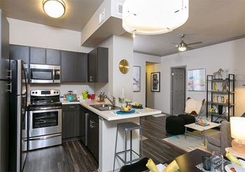 spacious open-concept kitchen and living area at Retreat Westminster Center apartments