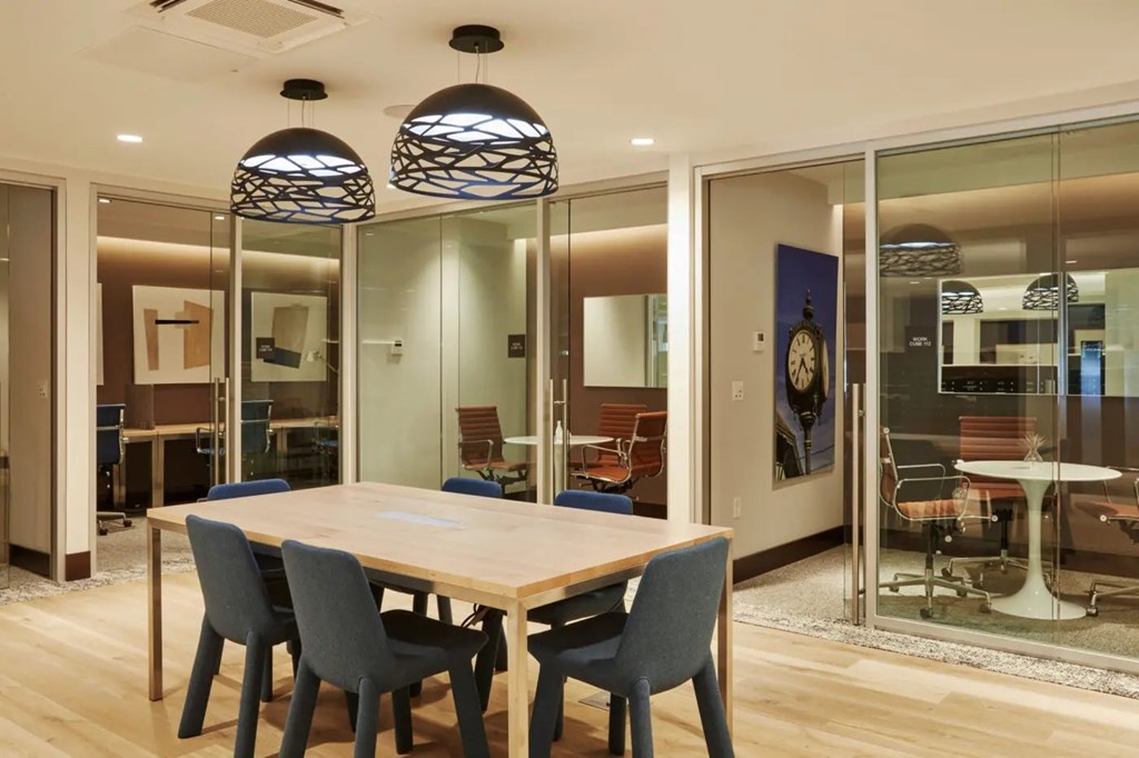 A room with a table and chairs.