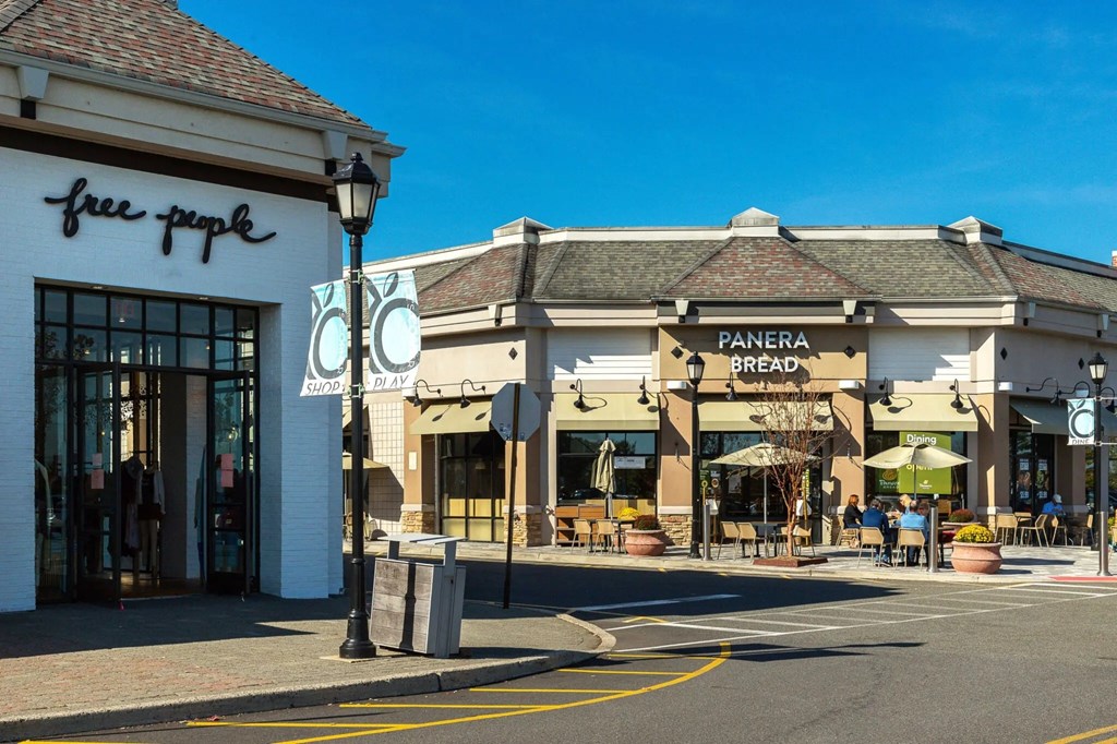 A street view of retail stores and restaurants