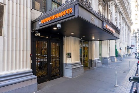 The front of a building with a sign that says "Rindolf Hoeffs".