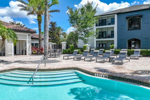 a swimming pool and sundeck at Verano apartments