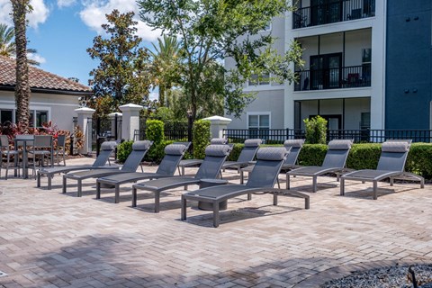 A sundeck with chairs at Verano apartments