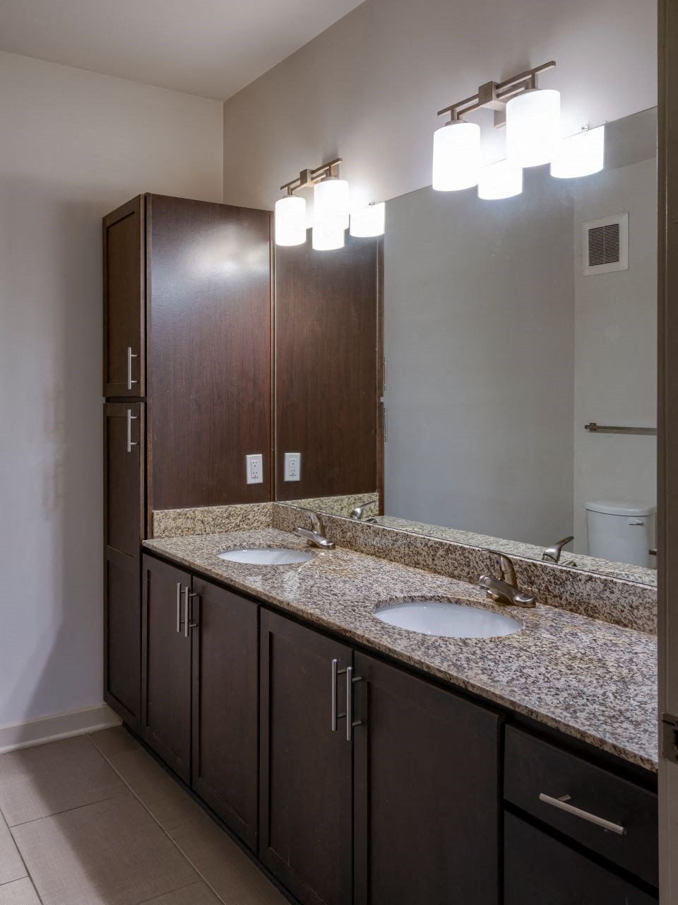 spacious bathroom with designer lighting and custom cabinetry at Artisan on 18th, Tennessee