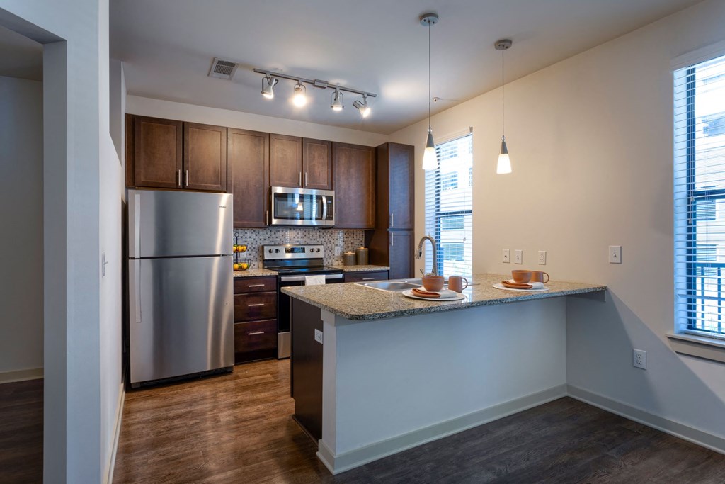 Spacious kitchen with breakfast bar and stainless appliances  at Artisan on 18th, Tennessee