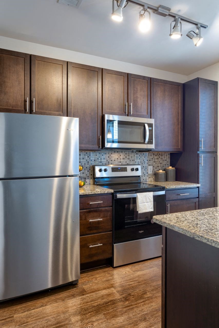 kitchen with stainless appliances and custom cabinetry at Artisan on 18th, Nashville, 37203