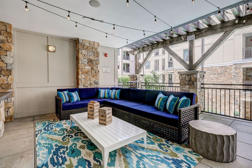 Outdoor terrace lounge overlooking pool at Berkshire Dilworth apartments