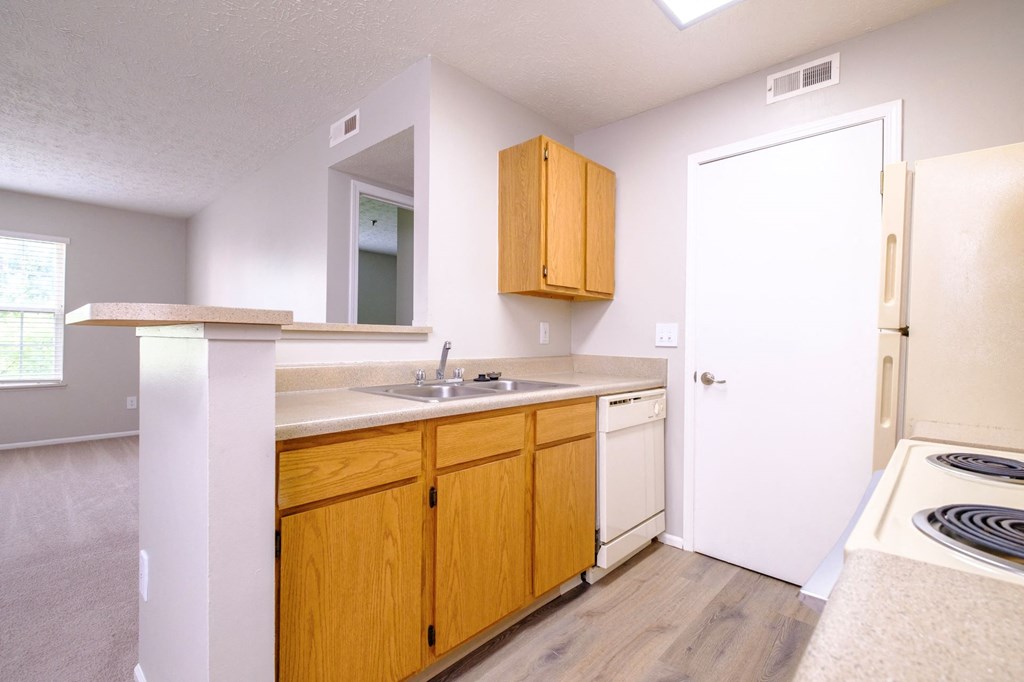 a spacious kitchen with wooden cabinetry
