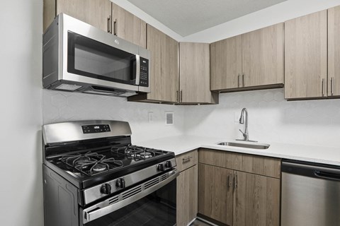 a kitchen with a stove and a microwave