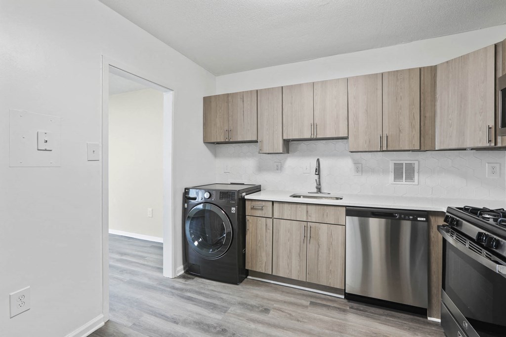 Skyline Towers apartments offer a modern kitchen with stainless steel kitchen appliances and wooden cabinets