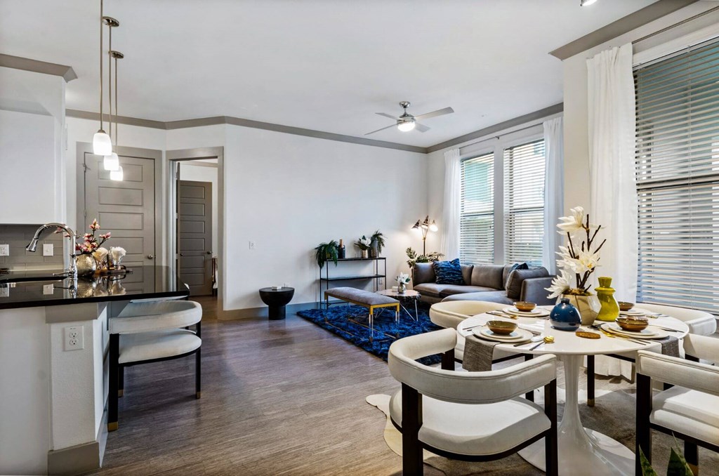 Living room with dining and kitchenat Reveal at Bayside, Rowlett, TX, 75088